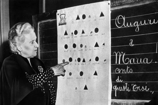 Maria Montessori explaining grammar symbols