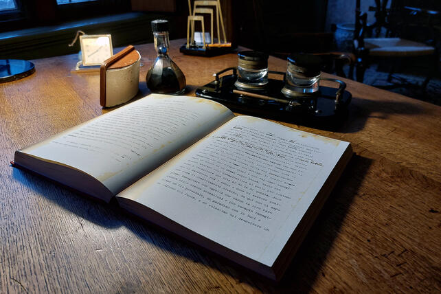 Maria Montessori's desk featuring writing