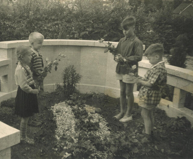 Young children visiting Maria Montessori's grave