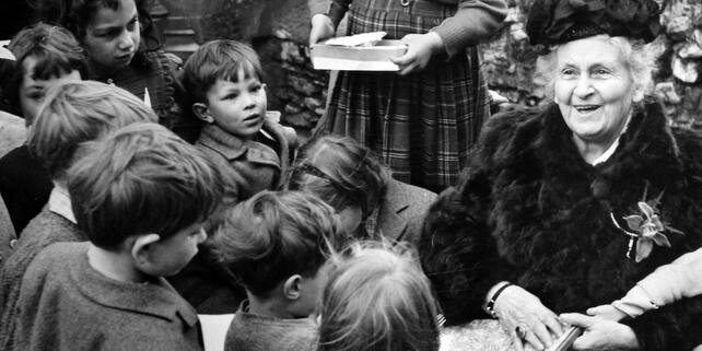 Maria Montessori with children in 1951 at Gatehouse School London