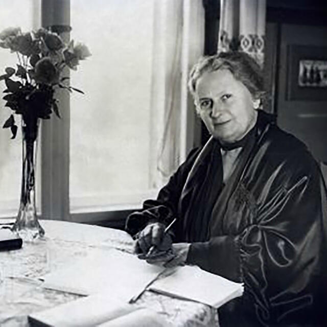 Maria Montessori reviewing correspondence