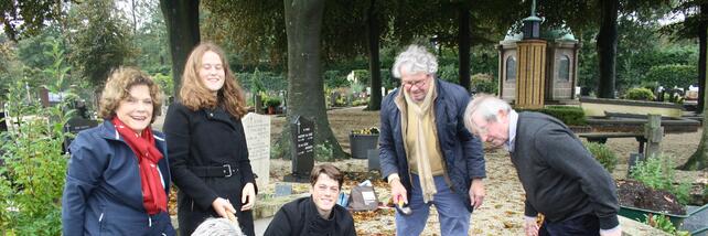 Montessori family planting tulips at Maria Montessori's grave