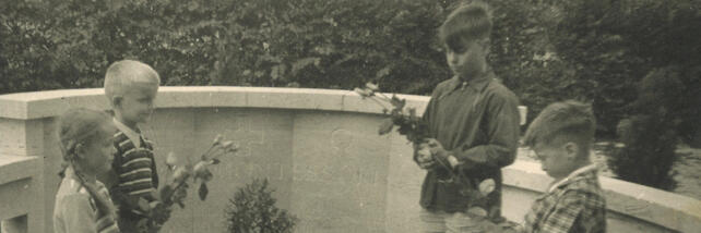 Young children visiting Maria Montessori's grave